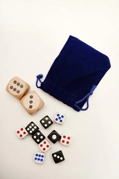 Dice on a white background. Large and small dice. Stock Photos