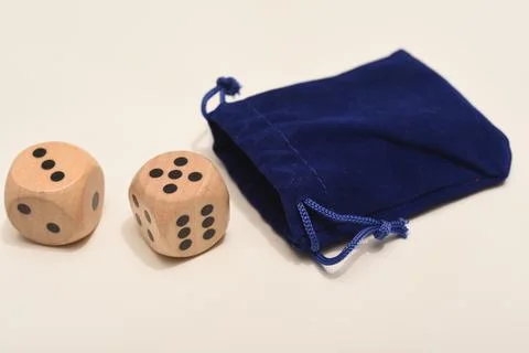 Dice on a white background. Large and small dice. Stock Photos