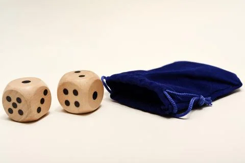 Dice on a white background. Large and small dice. Stock Photos