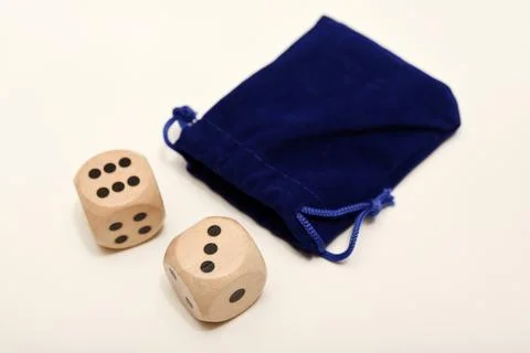 Dice on a white background. Large and small dice. Stock Photos