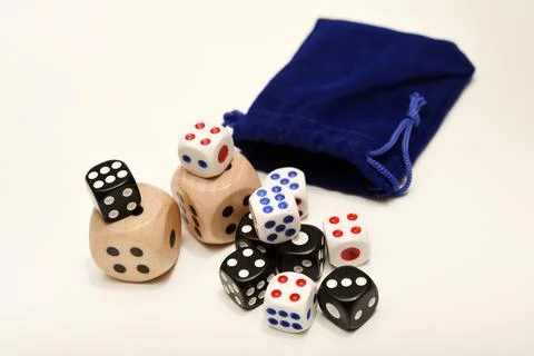 Dice on a white background. Large and small dice. Stock Photos