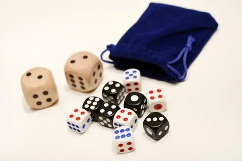 Dice on a white background. Large and small dice. Stock Photos