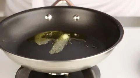Diced bacon being added to a pan of clarified butter Video stock 24670057