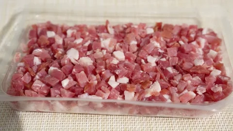 Diced Bacon Rotating in a Detailed Close-Up Stock Footage 341484129