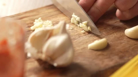 Diced garlic on a chopping board. Stock Footage 263758066