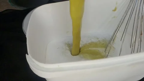 Diced Mango Pieces Dropping into Thick Cream in Rectangular Glass Bowl Stock Footage 317010214