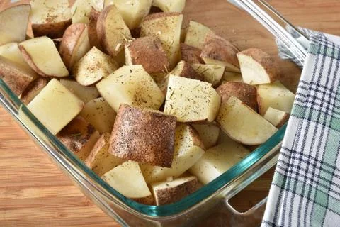 Diced potatoes in a baking dish Stock Photos