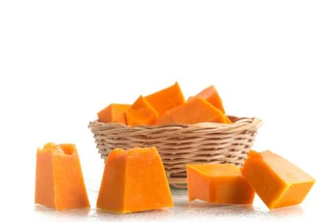Diced Pumpkin into a basket 스톡 사진