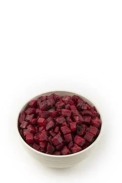 Diced raw beetroot isolated on white background. Stock Photos