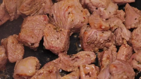 Diced turkey meat being fried in a pan. Stock Footage 314328936
