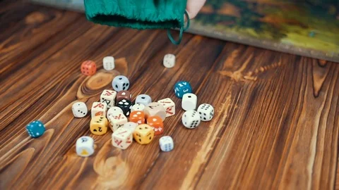 Dices Fall On a Wooden Table From Bag Video stock 72501882