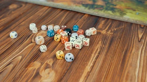 Dices Fall On a Wooden Table From Bag Stock Footage 72503496