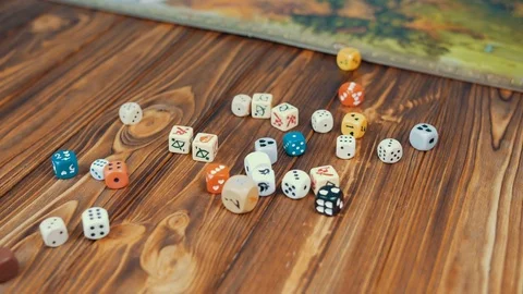 Dices Fall On a Wooden Table From Bag Video stock 72504907