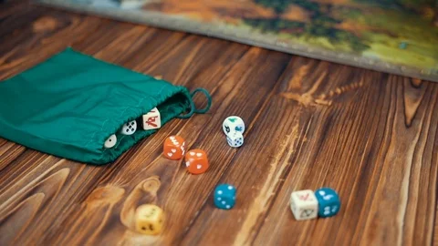 Dices Fall On a Wooden Table From Bag Stock-Footage 72603107