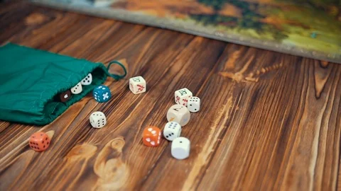 Dices Fall On a Wooden Table With Boardgame Stock Footage 72501058