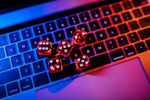 Dices group stacking on a laptop Stock Photos