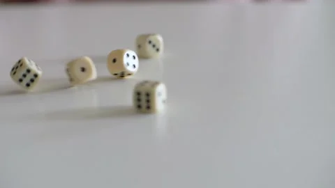 Dices rolling on the table in slow motion Stock Footage 153661149