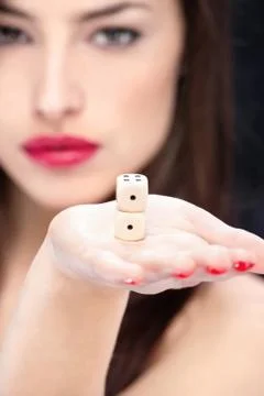 Dices in woman's hand Stock Photos