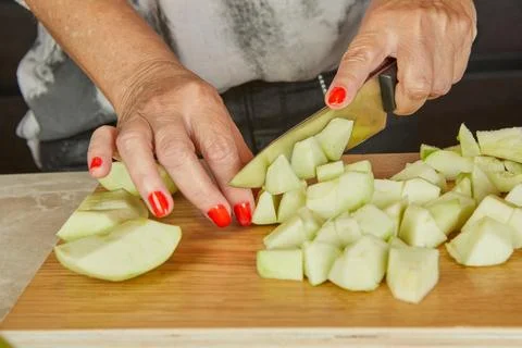 Dicing apples into small cubes Stock Photos