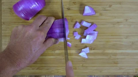 Dicing onions, overhead view Stock Footage