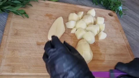 Dicing Potatoes into Cubes with Purple Knife | Food Preparation Stock Footage 345117372