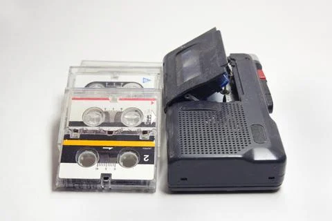 Dictaphone and stack of neatly layed cassettes in transparent plastic cover.. Stock Photos