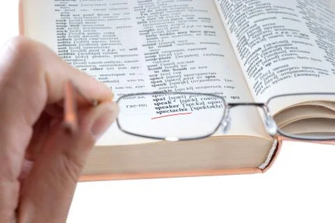 The dictionary and spectacles Stock Photos