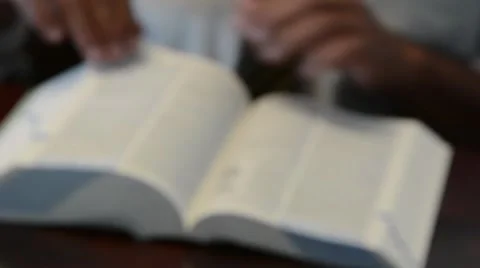 Dictionary close up with hands 2 Stock Footage 51589292