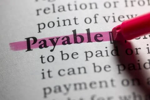 Dictionary definition of payable Stock Photos