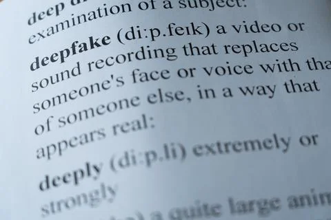 Dictionary page with the word deepfake with selective focussing Stock Photos