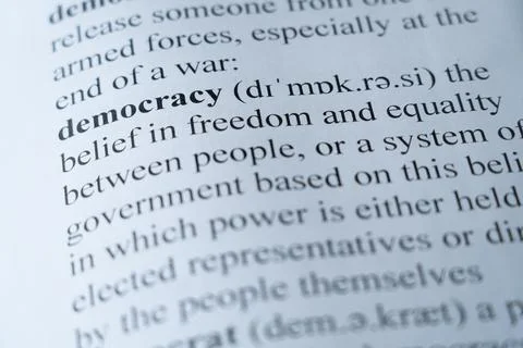 Dictionary page with the word democracy with selective focussing Stock Photos