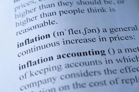 Dictionary page with the word inflation with selective focussing Stock Photos