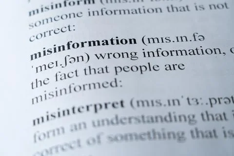 Dictionary page with the word misinformation with selective focussing Stock Photos