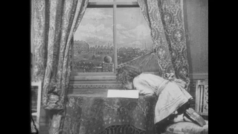 Diddums teases a policeman through a window, UK 1912 Video stock 136673412