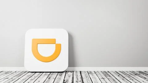 Didi App Icon 3D Symbol Shape on Wooden Floor Against Gray Wall with Copy Spa Stock Illustration