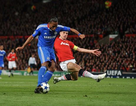 Didier Drogba Scores Chelsea's First Goal Despite Challenge Fro Nemanja Vidic. C Stock Photos