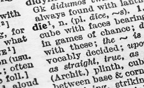 Die - Closeup macro of English dictionary page with word die concept Stock Photos