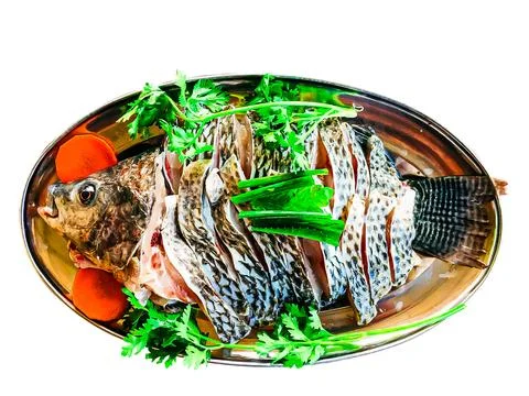 Die-cut image of fish on a plate with vegetables with clipping path 스톡 사진