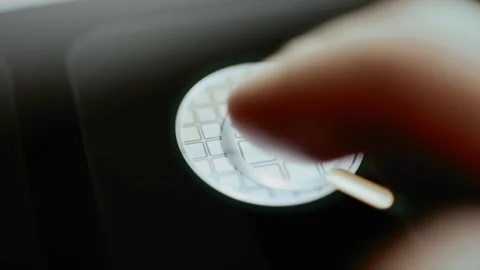 Die inspection card magnifies patterned wafer surface Stock Footage 346025945