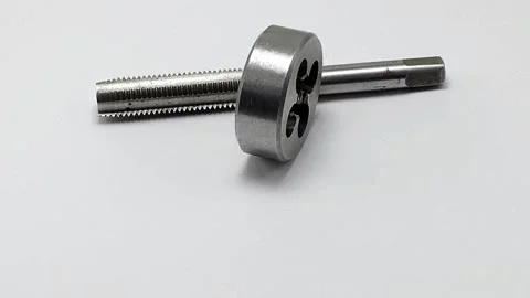 Die with a tap for threading, rotates in a circle on a white background Stock Footage 197401791