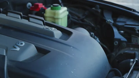 Diesel car v6 engine revving in open engine bay, close up cover movement with Stock Footage 323909585