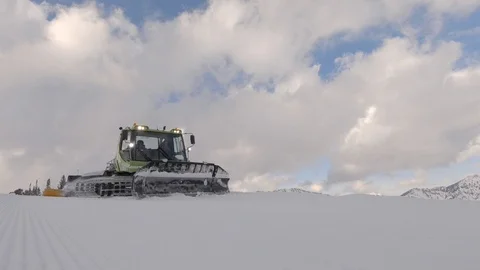 A diesel-electric Piston Bully snow groomer, Wasatch Mountains, Utah. Stock Footage 99809702
