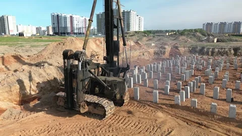 A diesel piling rig is seen driving concrete piles Stock Footage 321943431