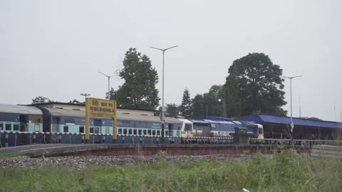 Diesel powered engine entering Mulroad station Stock Footage 248914780