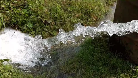Diesel-powered engine pumps are the means of irrigating agricultural land . Stock Footage 130440699