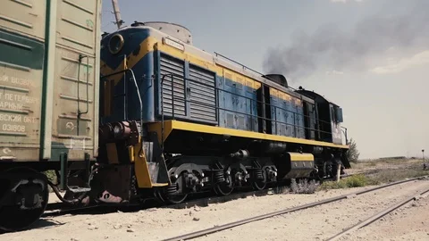 A diesel train is pushing a wagon. Stock Footage 111395440