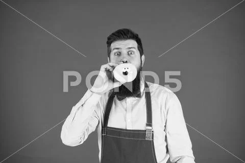Diet and healthy food. Baker eat doughnut. Chef man in cafe. Calorie. Feel Stock Photos