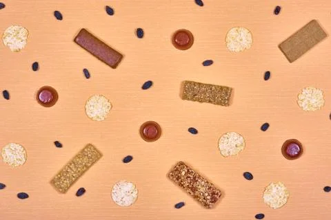 Diet bars, marmalade, bread rolls and raisins. Stock Photos