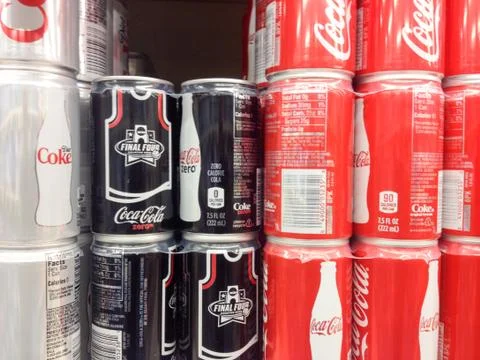Diet Coke zero classic coca cola cans cases stacked in supermarket background Stock Photos