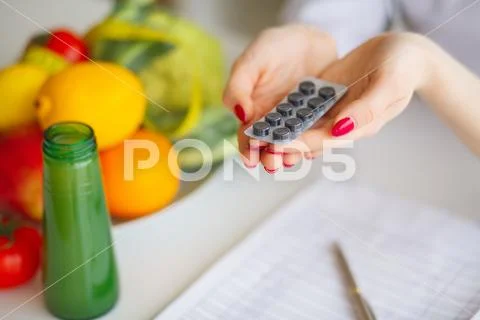 Diet. Female Nutritionist Holding Blisters of Pills Stock Photos
